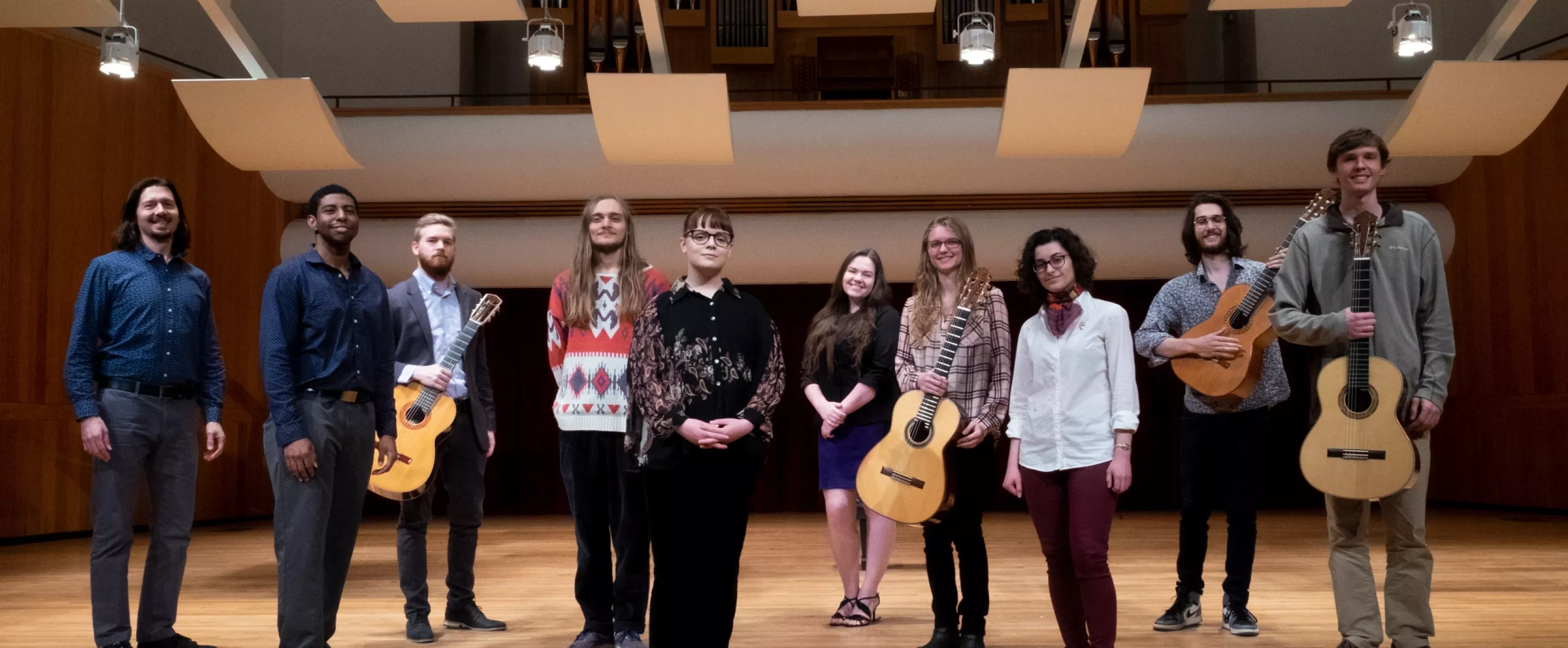 Music students pose with their guitars