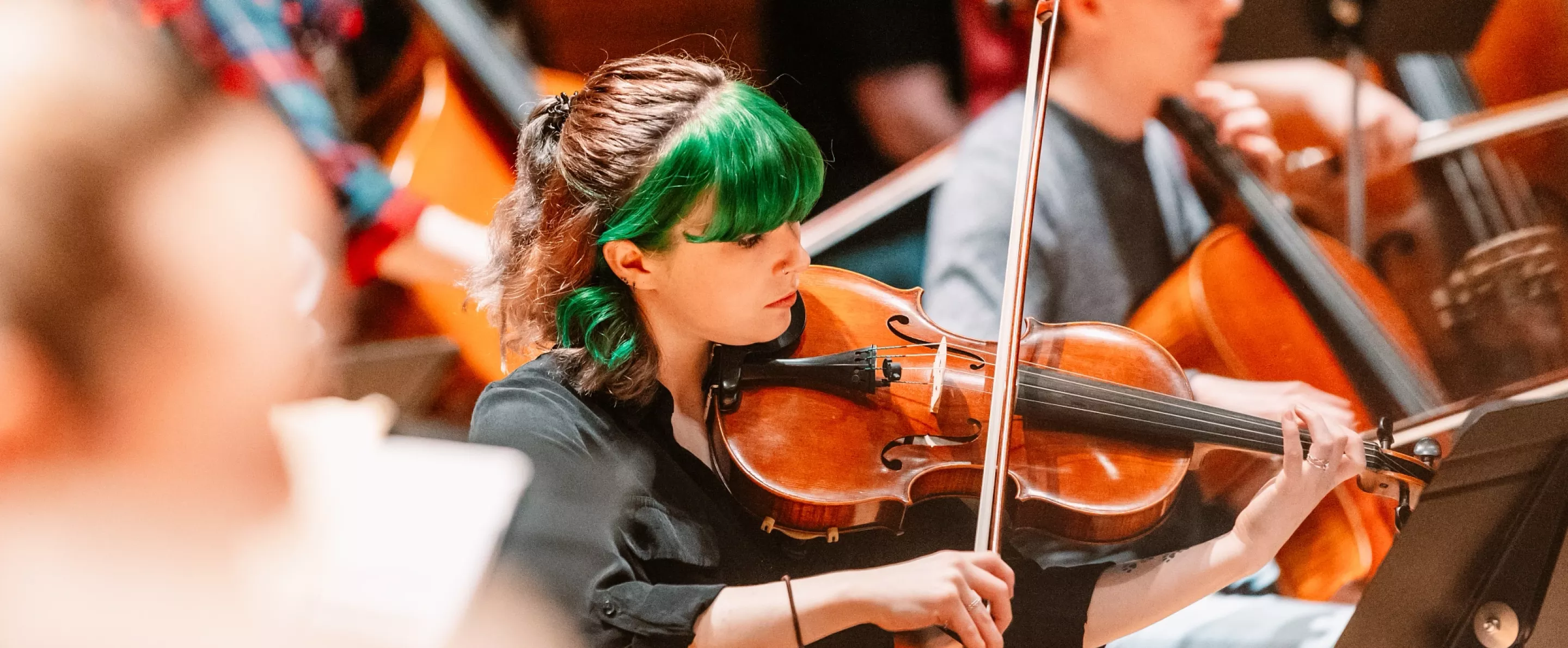 Student playing violin at Symphony Orchestra concert