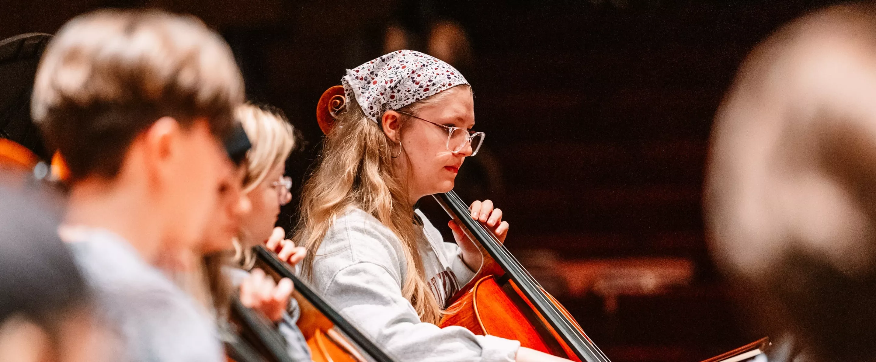 Student playing cello at Symphony Orchestra concert