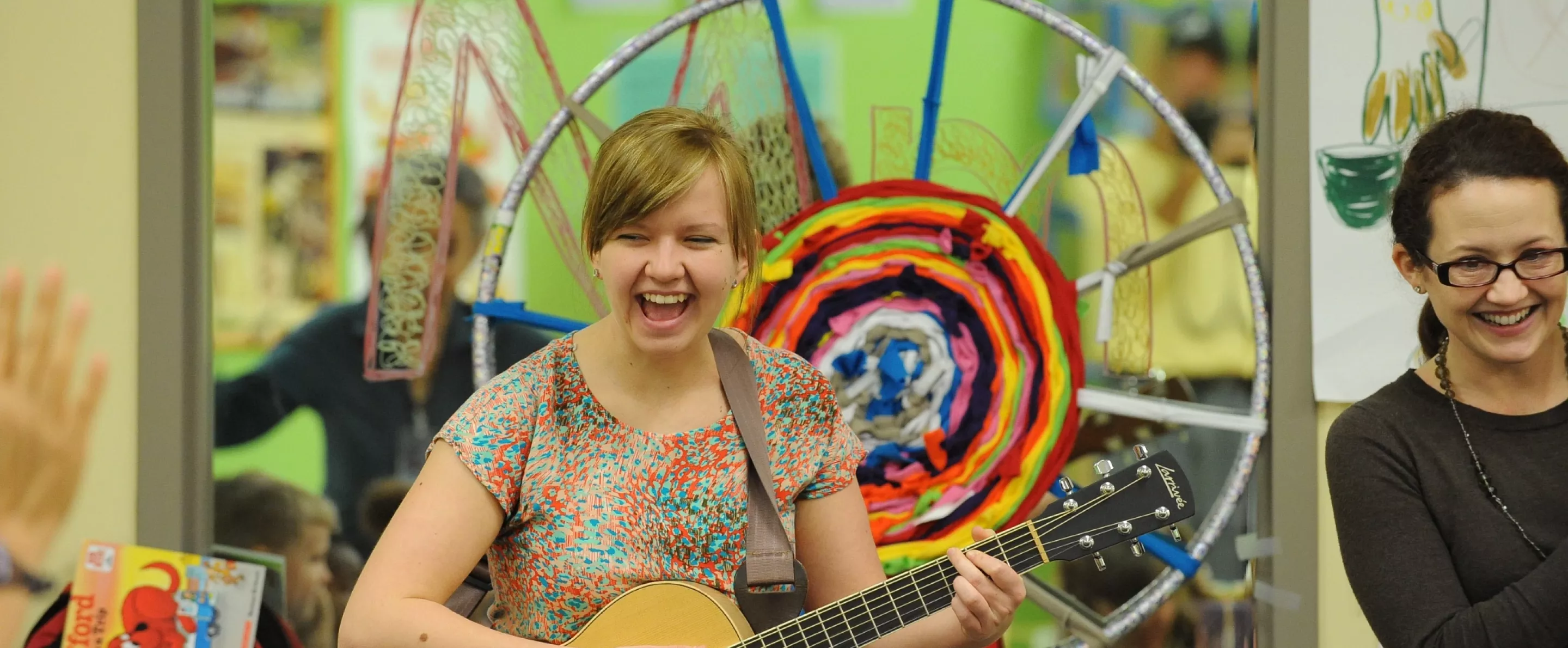 Music Therapy Clinic student playing guitar