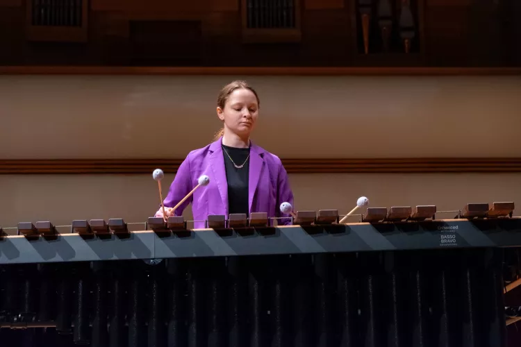 Student playing percussion