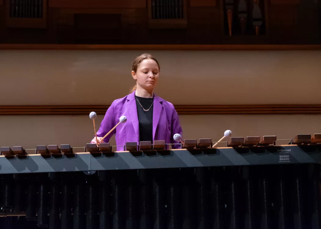 Student playing percussion