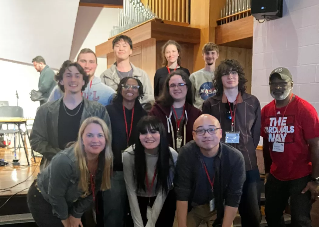 Music composition students at a conference