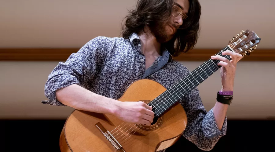 Man plays guitar