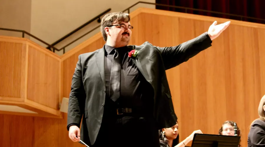 Music conductor with wind band