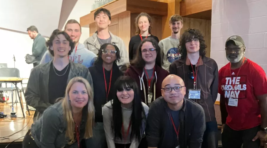 Music composition students at a conference